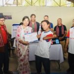 a boccia player buddha rai receiving award from Deputy Mayor